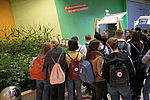 A group of young people get information at the exhibition stand