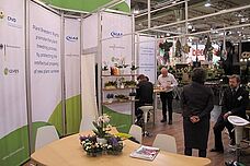 Four people at a booth